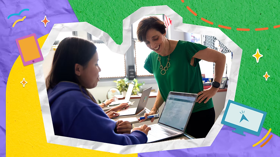A teacher supports a student on a laptop in the classroom.